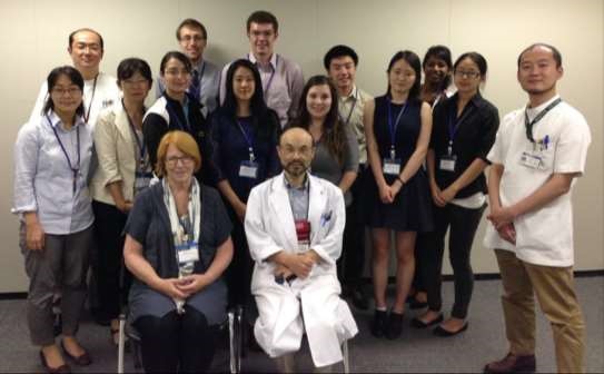 Prof. Pat Lambert (seated at front) and JCMUstudents meet with medical professionals during the HCJ 2015 program.
